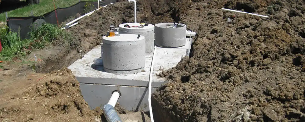 Septic system repair and installation site with tank access ports in Baltimore, MD